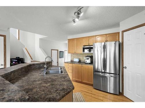 426 Tuscany Ridge Heights Nw, Calgary, AB - Indoor Photo Showing Kitchen With Double Sink