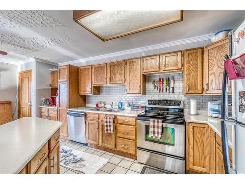 26 Butte Place Nw, Calgary, AB - Indoor Photo Showing Kitchen With Double Sink