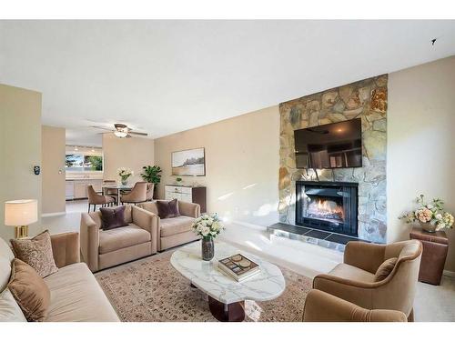 163 Woodglen Close Sw, Calgary, AB - Indoor Photo Showing Living Room With Fireplace