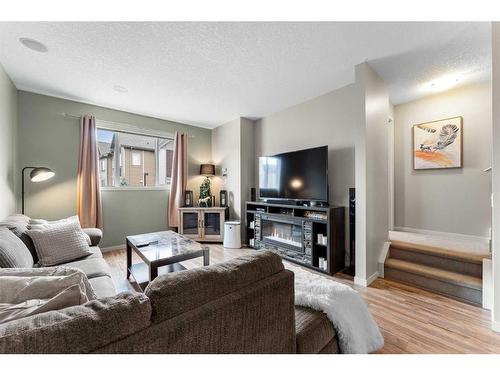 229 Copperpond Row Se, Calgary, AB - Indoor Photo Showing Living Room