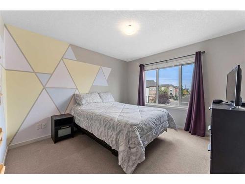 229 Copperpond Row Se, Calgary, AB - Indoor Photo Showing Bedroom