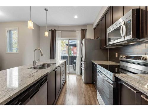 229 Copperpond Row Se, Calgary, AB - Indoor Photo Showing Kitchen With Stainless Steel Kitchen With Double Sink With Upgraded Kitchen