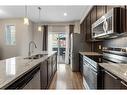 229 Copperpond Row Se, Calgary, AB  - Indoor Photo Showing Kitchen With Stainless Steel Kitchen With Double Sink With Upgraded Kitchen 