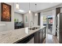 229 Copperpond Row Se, Calgary, AB  - Indoor Photo Showing Kitchen With Stainless Steel Kitchen With Double Sink With Upgraded Kitchen 