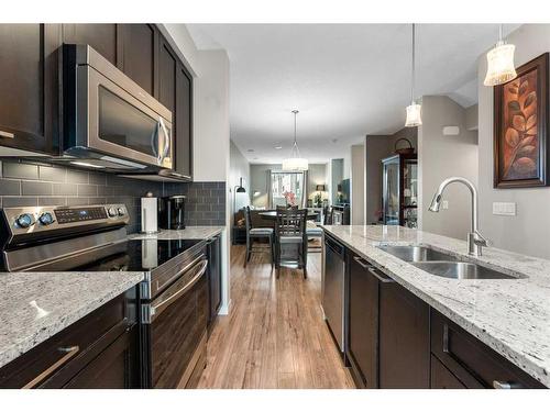 229 Copperpond Row Se, Calgary, AB - Indoor Photo Showing Kitchen With Stainless Steel Kitchen With Double Sink With Upgraded Kitchen