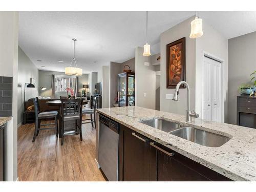 229 Copperpond Row Se, Calgary, AB - Indoor Photo Showing Kitchen With Double Sink