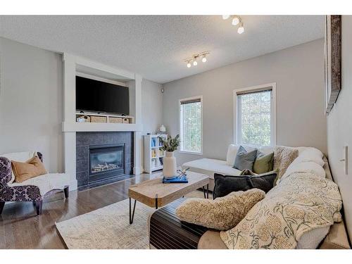 182 Mahogany Heights Se, Calgary, AB - Indoor Photo Showing Living Room With Fireplace