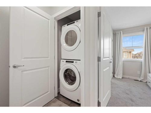 243 Legacy Common Se, Calgary, AB - Indoor Photo Showing Laundry Room