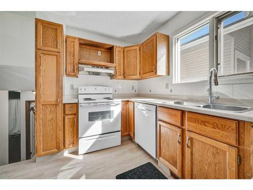 51 Sandstone Rise Nw, Calgary, AB - Indoor Photo Showing Kitchen With Double Sink