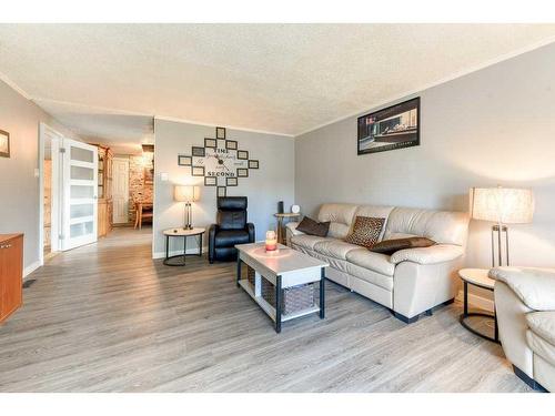 859 Brentwood Crescent, Strathmore, AB - Indoor Photo Showing Living Room With Fireplace