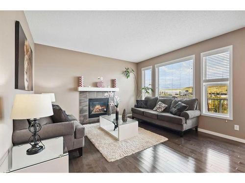 2168 Brightoncrest Green Se, Calgary, AB - Indoor Photo Showing Living Room With Fireplace