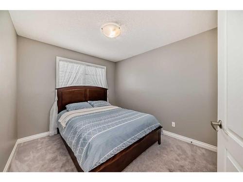 144 Cove Rise, Chestermere, AB - Indoor Photo Showing Bedroom