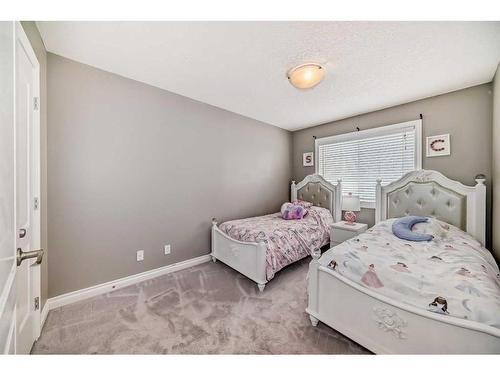 144 Cove Rise, Chestermere, AB - Indoor Photo Showing Bedroom