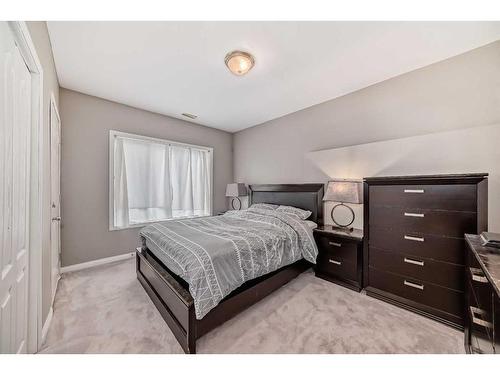 144 Cove Rise, Chestermere, AB - Indoor Photo Showing Bedroom