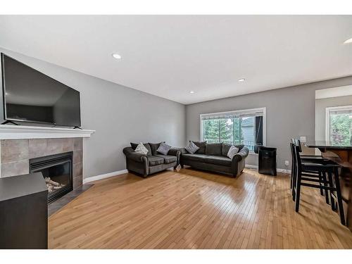 144 Cove Rise, Chestermere, AB - Indoor Photo Showing Living Room With Fireplace