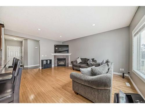 144 Cove Rise, Chestermere, AB - Indoor Photo Showing Living Room With Fireplace