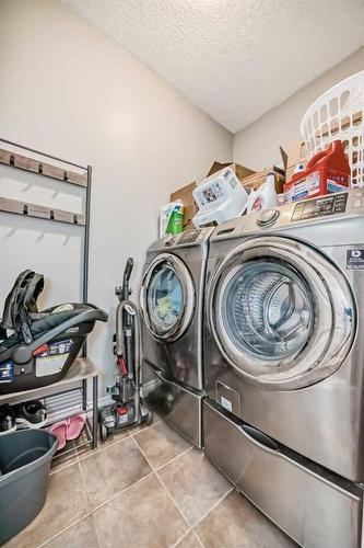 144 Cove Rise, Chestermere, AB - Indoor Photo Showing Laundry Room