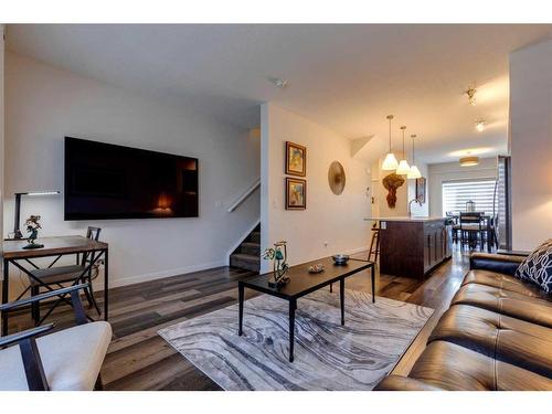 116 Shawnee Common Sw, Calgary, AB - Indoor Photo Showing Living Room