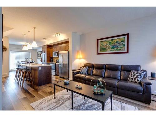 116 Shawnee Common Sw, Calgary, AB - Indoor Photo Showing Living Room