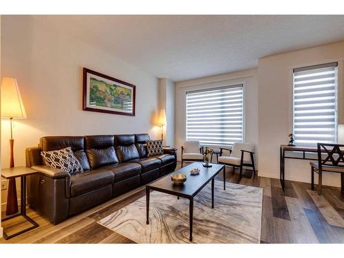 116 Shawnee Common Sw, Calgary, AB - Indoor Photo Showing Living Room