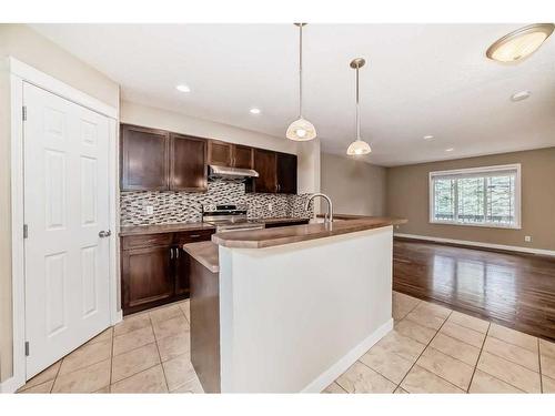 99 Panatella Park Nw, Calgary, AB - Indoor Photo Showing Kitchen With Upgraded Kitchen