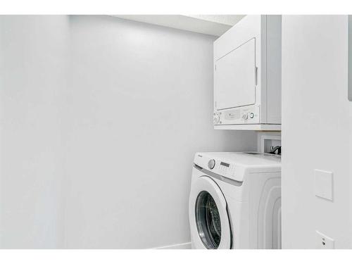 1221-8810 Royal Birch Boulevard Nw, Calgary, AB - Indoor Photo Showing Laundry Room