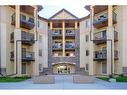 1221-8810 Royal Birch Boulevard Nw, Calgary, AB  - Outdoor With Balcony With Facade 