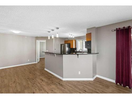 1402-8810 Royal Birch Boulevard Nw, Calgary, AB - Indoor Photo Showing Kitchen