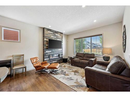 241 Mahogany Parade Se, Calgary, AB - Indoor Photo Showing Living Room With Fireplace