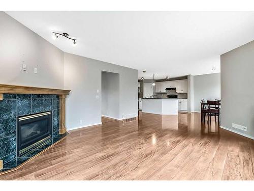 41 Bridlecreek Park Sw, Calgary, AB - Indoor Photo Showing Living Room With Fireplace