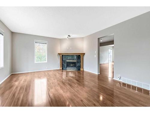 41 Bridlecreek Park Sw, Calgary, AB - Indoor Photo Showing Living Room With Fireplace