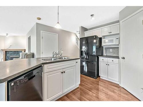 41 Bridlecreek Park Sw, Calgary, AB - Indoor Photo Showing Kitchen With Double Sink