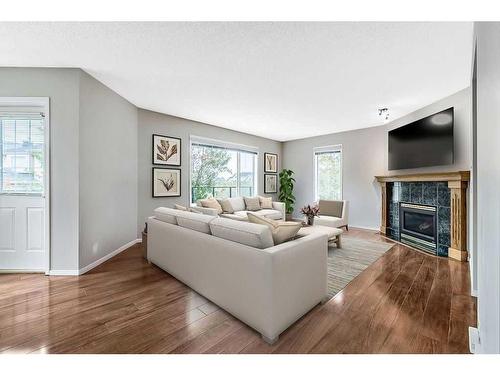 41 Bridlecreek Park Sw, Calgary, AB - Indoor Photo Showing Living Room With Fireplace