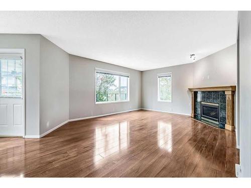 41 Bridlecreek Park Sw, Calgary, AB - Indoor Photo Showing Living Room With Fireplace