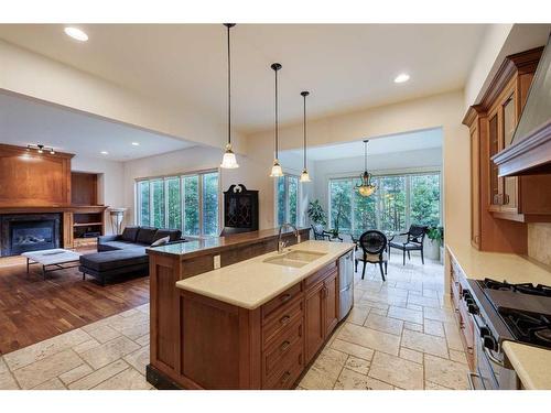 67 Discovery Valley Cove Sw, Calgary, AB - Indoor Photo Showing Kitchen With Fireplace