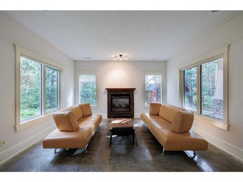 67 Discovery Valley Cove Sw, Calgary, AB - Indoor Photo Showing Living Room With Fireplace