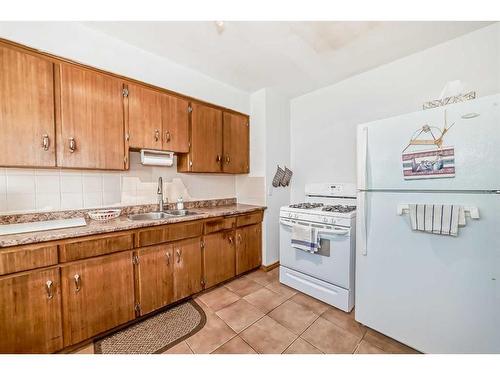 128-2211 19 Street Ne, Calgary, AB - Indoor Photo Showing Kitchen With Double Sink