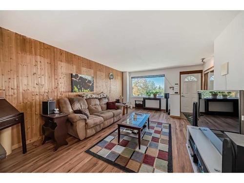 128-2211 19 Street Ne, Calgary, AB - Indoor Photo Showing Living Room With Fireplace