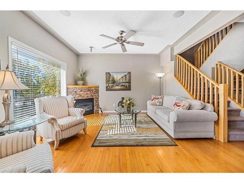 19 Rocky Vista Terrace Nw, Calgary, AB - Indoor Photo Showing Living Room With Fireplace