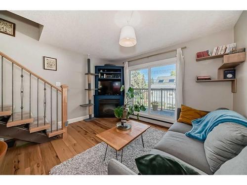 8-810 2 Street Ne, Calgary, AB - Indoor Photo Showing Living Room With Fireplace