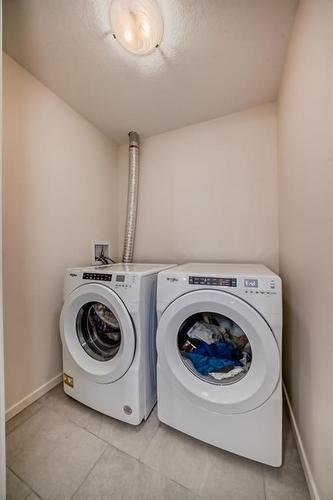 8119-151 Legacy Main Street Se, Calgary, AB - Indoor Photo Showing Laundry Room