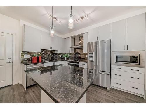 8119-151 Legacy Main Street Se, Calgary, AB - Indoor Photo Showing Kitchen With Stainless Steel Kitchen With Upgraded Kitchen