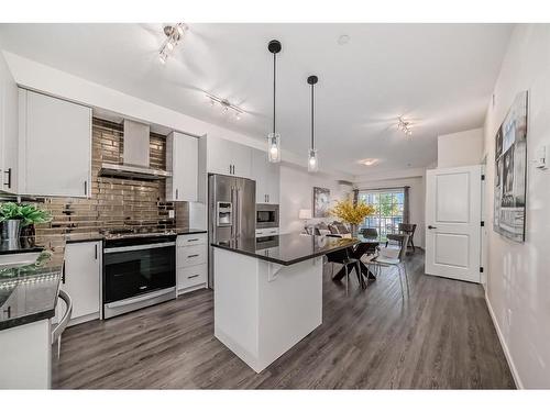 8119-151 Legacy Main Street Se, Calgary, AB - Indoor Photo Showing Kitchen With Stainless Steel Kitchen With Upgraded Kitchen