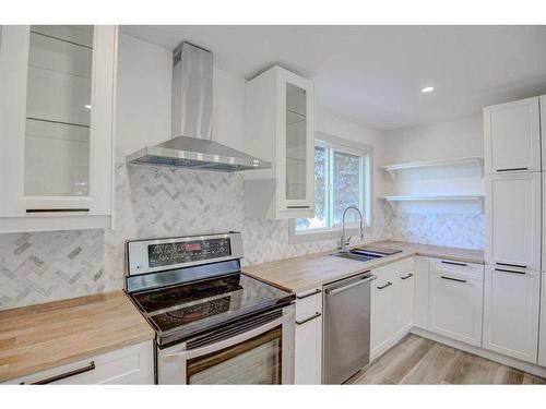 205 Allan Crescent Se, Calgary, AB - Indoor Photo Showing Kitchen With Double Sink