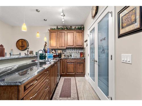 47 Cimarron Estates Road, Okotoks, AB - Indoor Photo Showing Kitchen With Double Sink