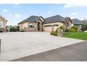 47 Cimarron Estates Road, Okotoks, AB  - Outdoor With Facade 