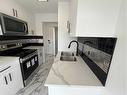 16-2020 16 Avenue Nw, Calgary, AB  - Indoor Photo Showing Kitchen With Double Sink With Upgraded Kitchen 