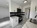 16-2020 16 Avenue Nw, Calgary, AB  - Indoor Photo Showing Kitchen With Double Sink 