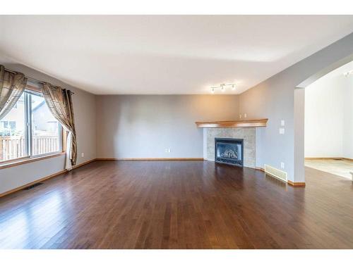 136 New Brighton Lane Se, Calgary, AB - Indoor Photo Showing Living Room With Fireplace