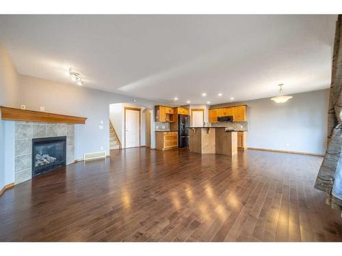 136 New Brighton Lane Se, Calgary, AB - Indoor Photo Showing Living Room With Fireplace